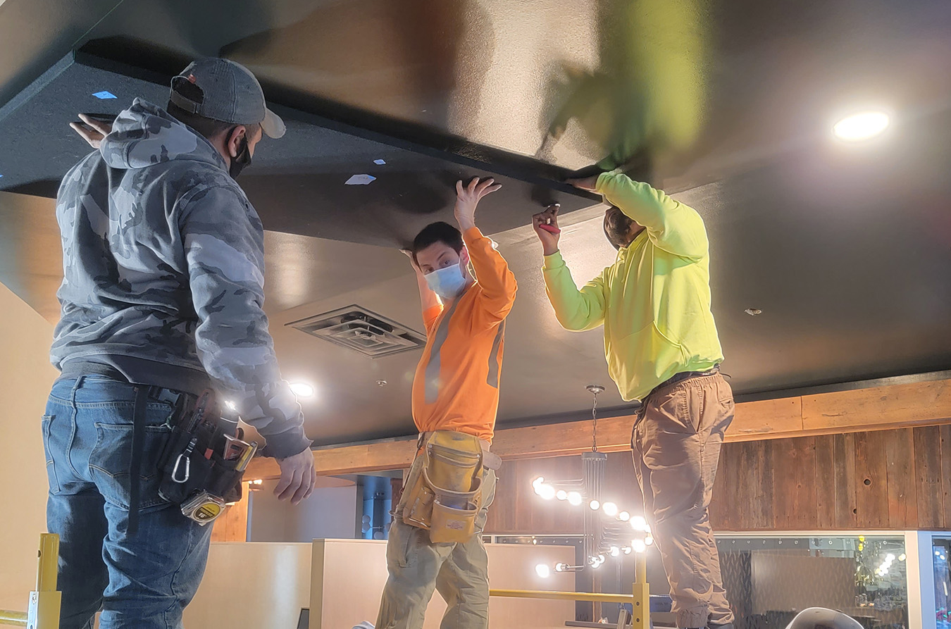 construction workers working on ceiling