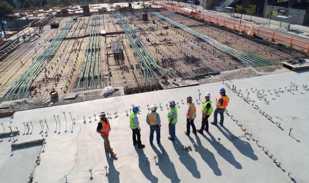 Aerial view of a construction crew on a reinforced concrete deck