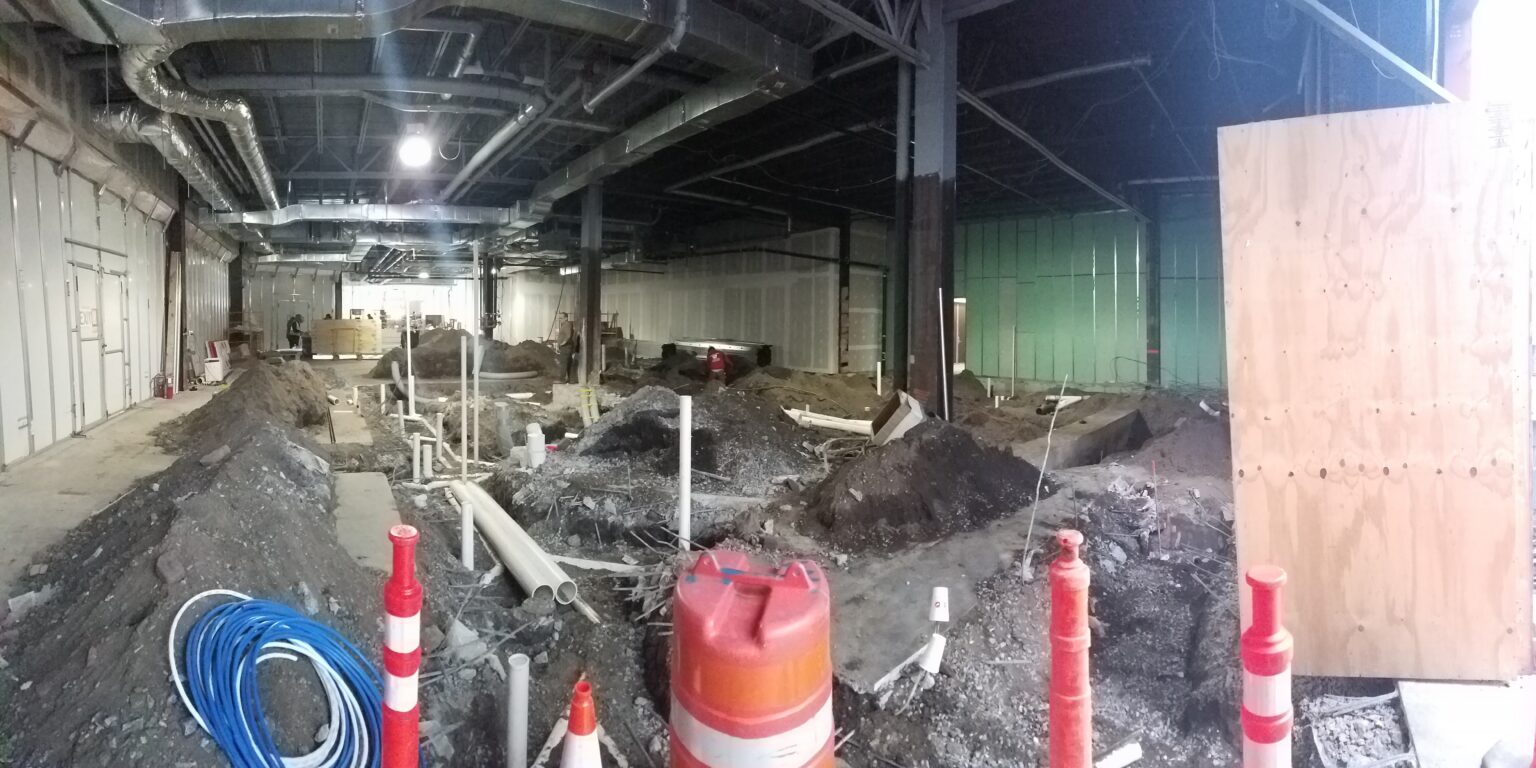 Interior of the Zinburger space during construction, with excavated floor and exposed plumbing