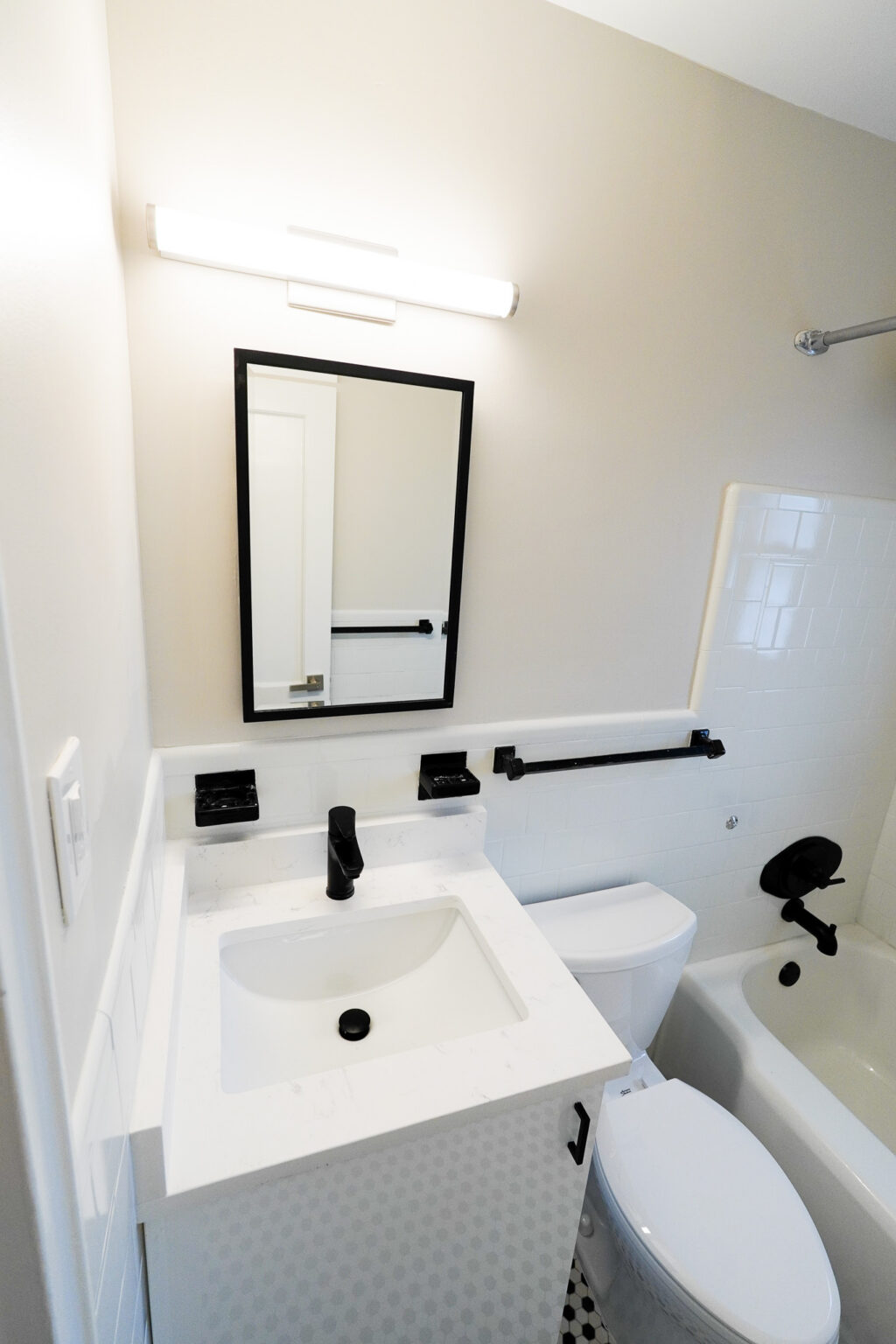 Accessible bathroom vanity and grab bars at Park View Apartments