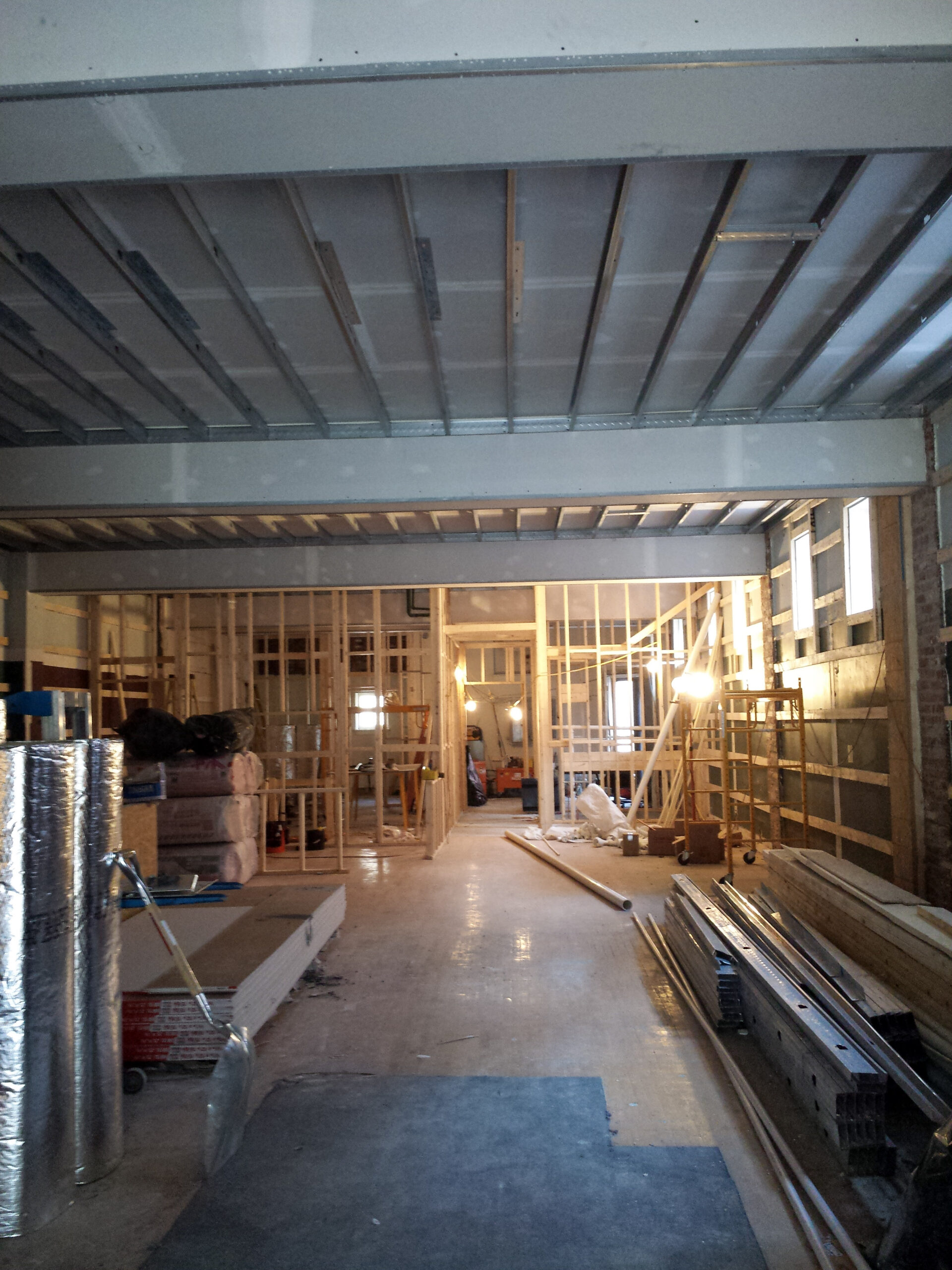 Gutted interior with exposed joists and ceiling before the fit-out at the Patrick Maxwell Building