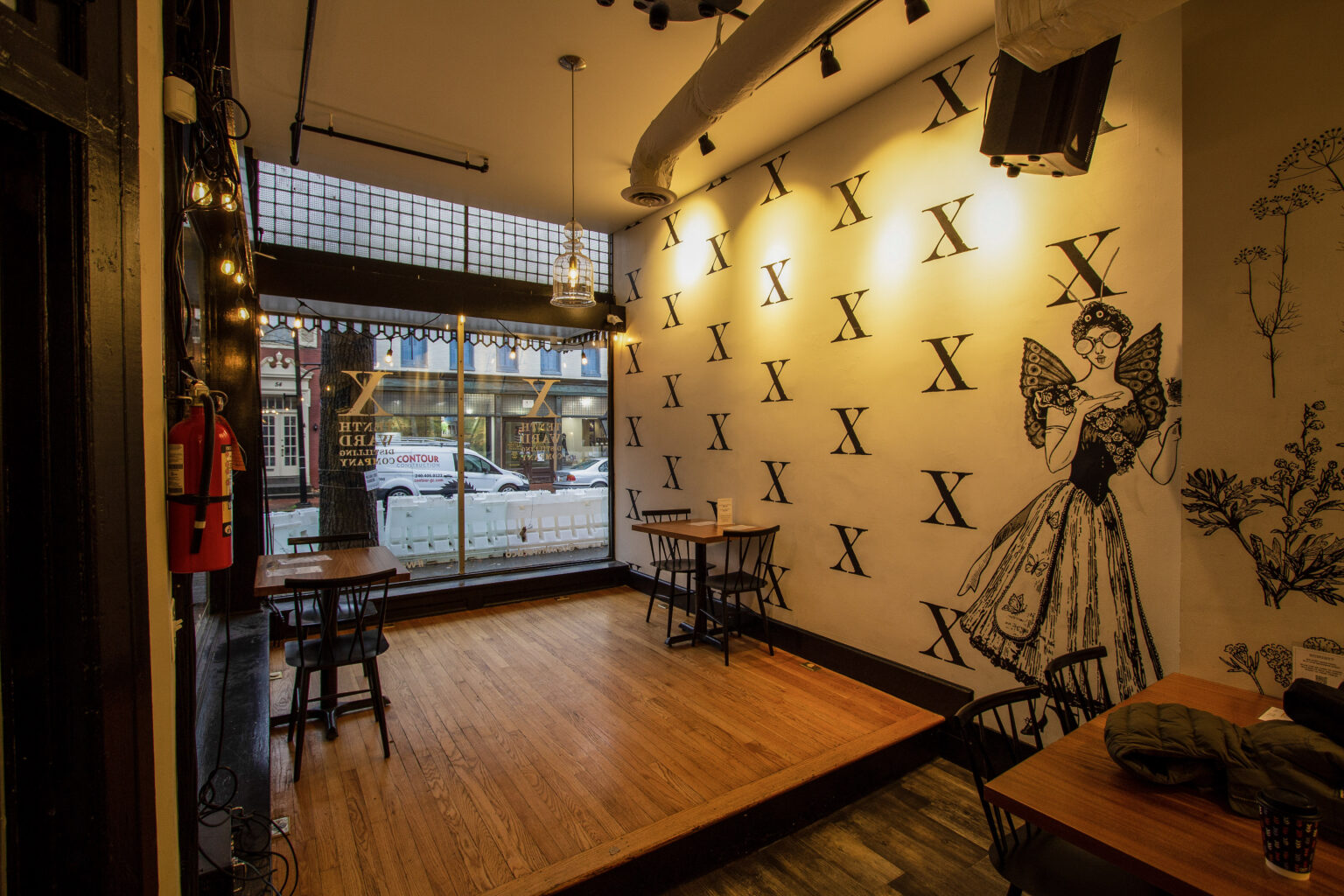 Maxwell's dining room with a patterned feature wall and warm pendant lighting