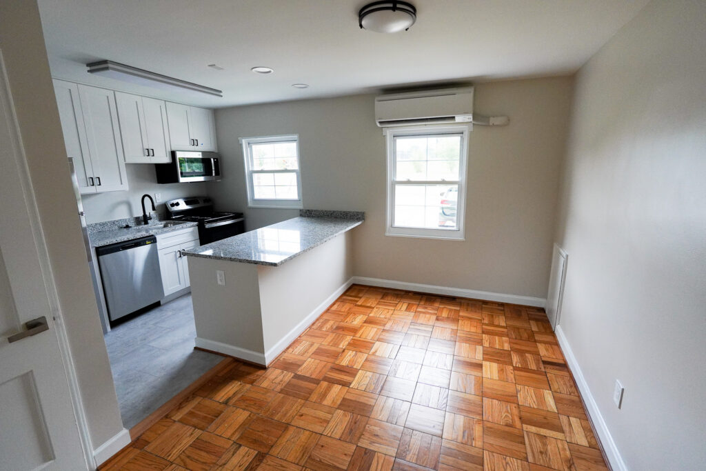 Renovated kitchen with granite counters and peninsula at Park View Apartments